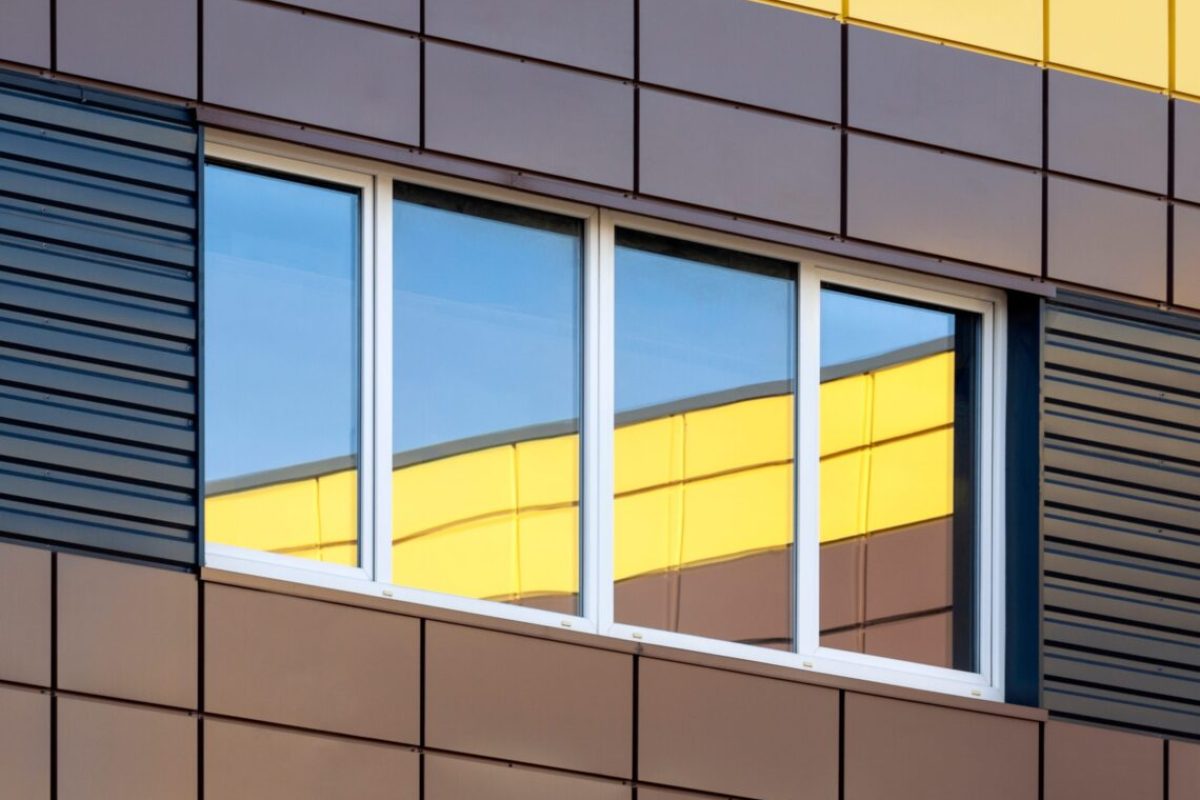 Abstract modern building exterior with colorful window reflection, contemporary architecture