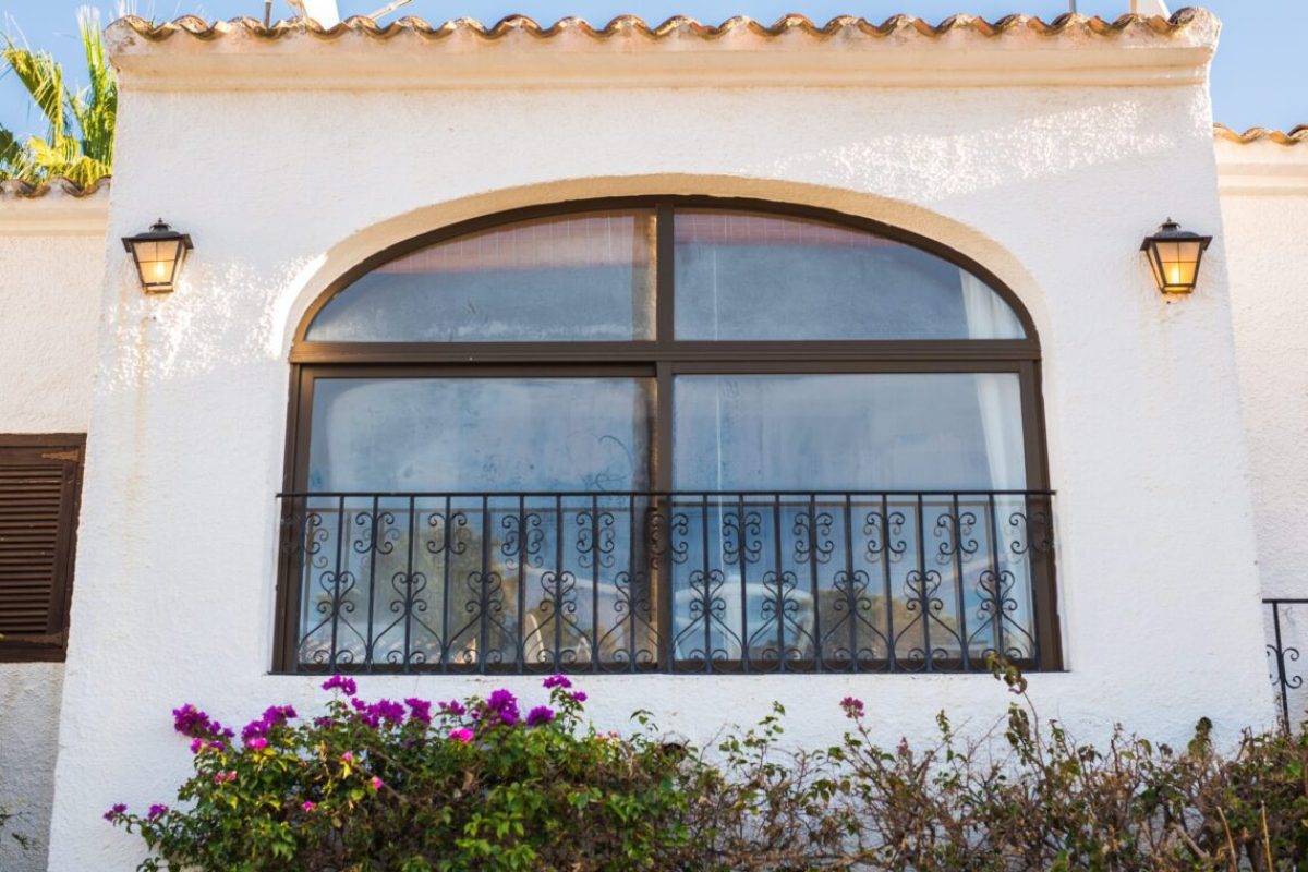 Design, architecture and exterior concept - Large spacious window on the white facade.