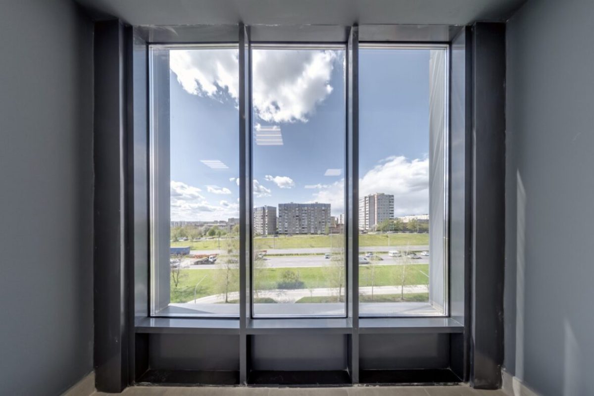 empty modern hall room with columns, doors and panoramic windows.