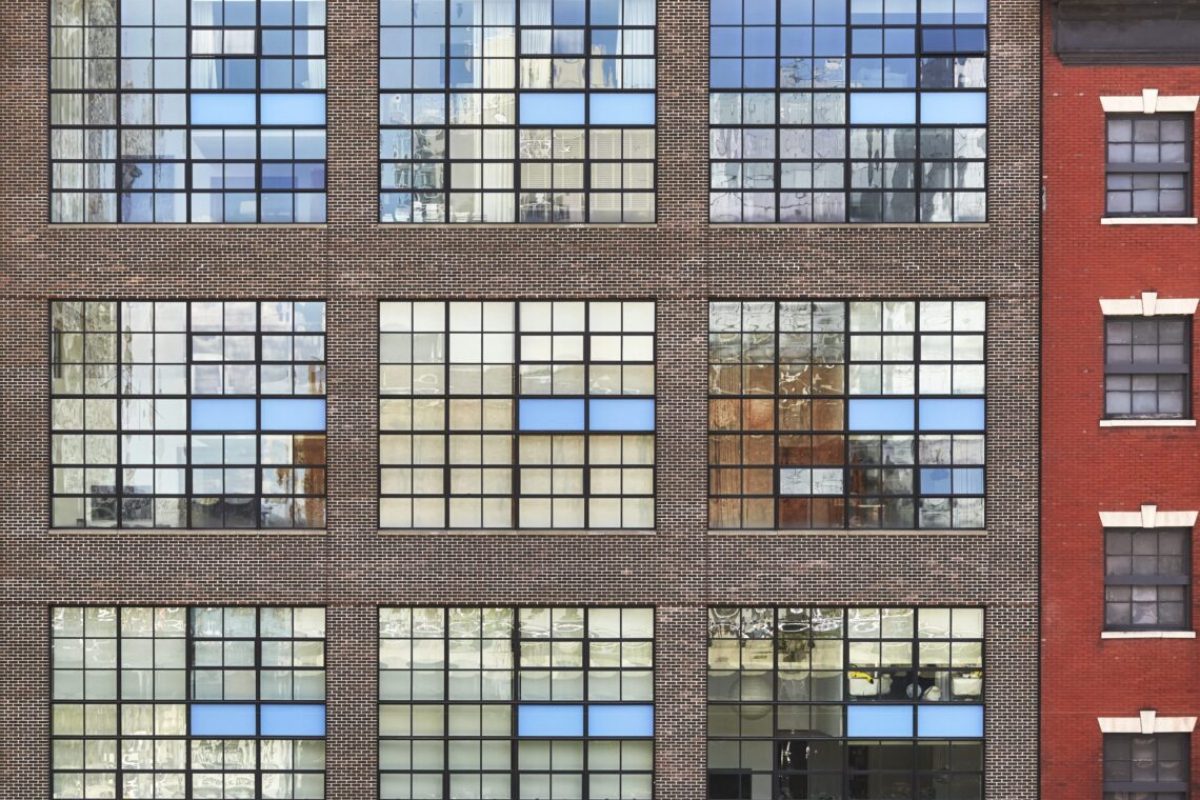 Facade of an old brick building in downtown New York, USA.
