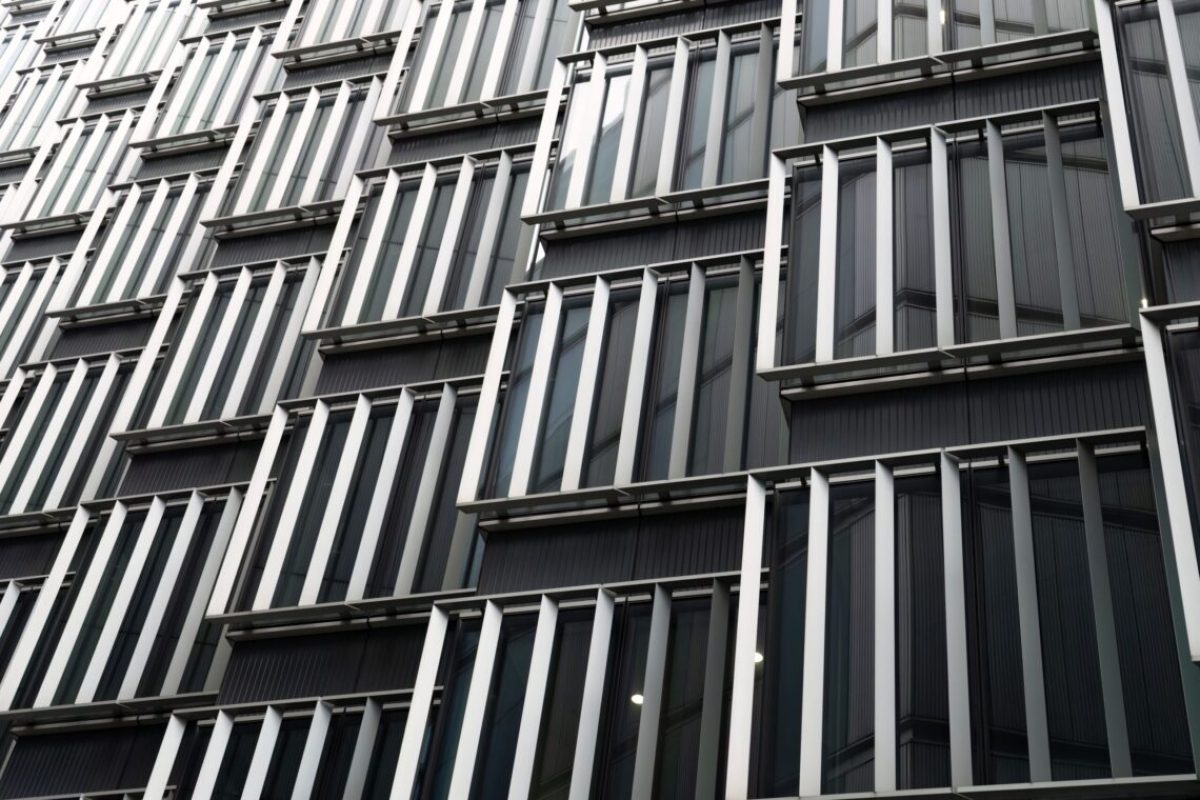 A greyscale shot of a modern building facade