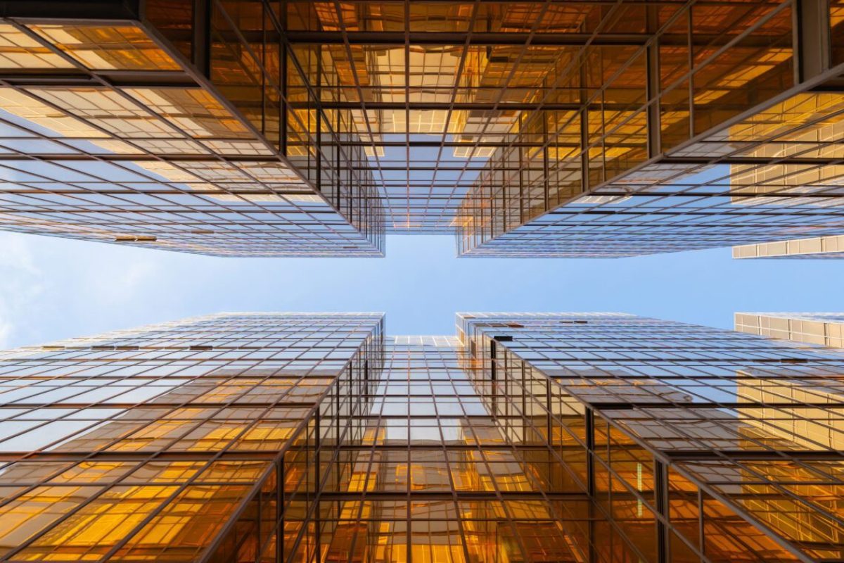 Golden building. Windows glass of modern office skyscrapers in technology and business concept. Facade design. Construction structure of architecture or engineering. Exterior for urban city background