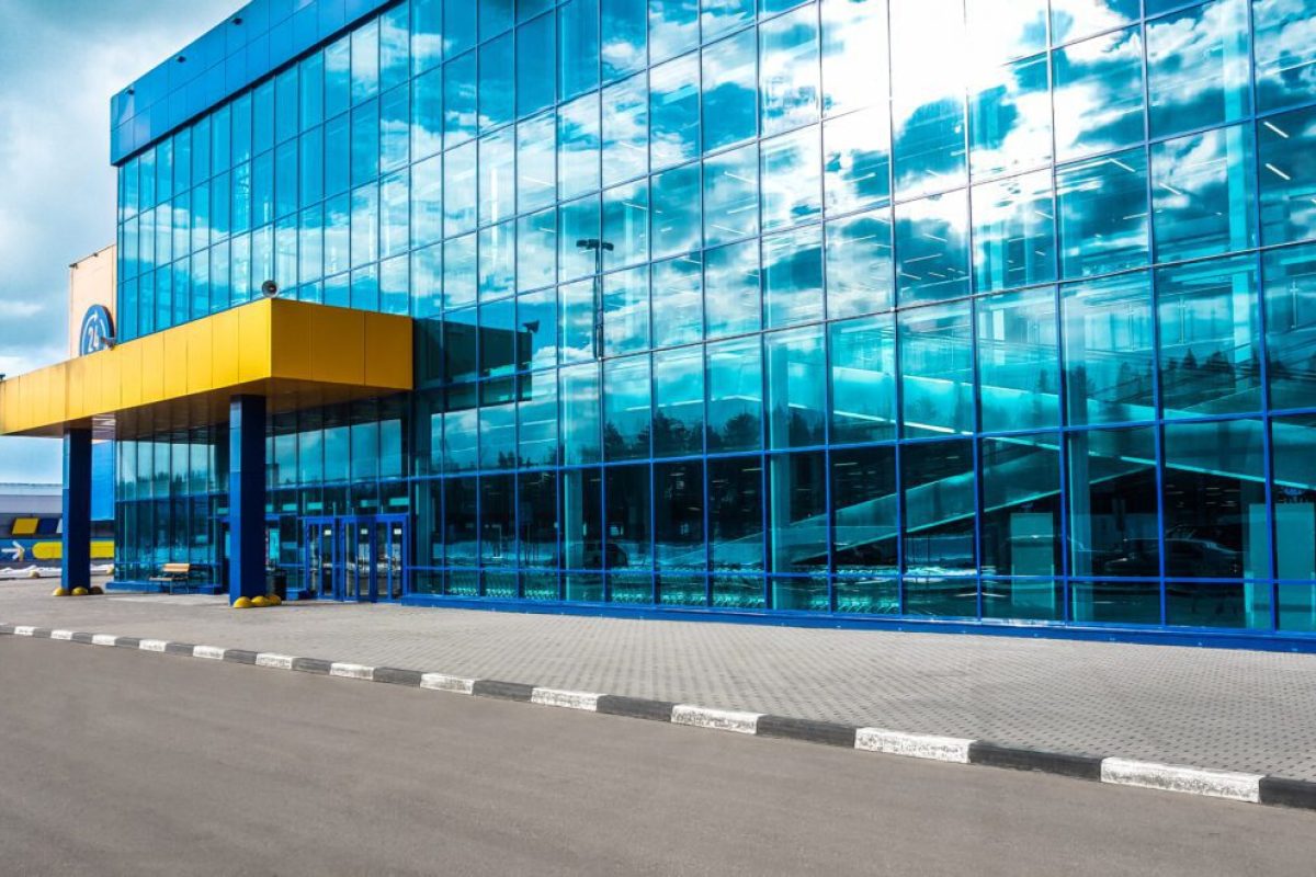 Skyscraper windows with reflection of the sky. Modern buildings.