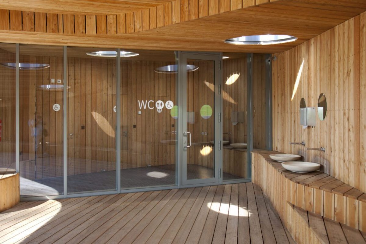 The Estonian Road Museum, visitor facilities, modern architecture, a wood clad washroom with basins and toilets.