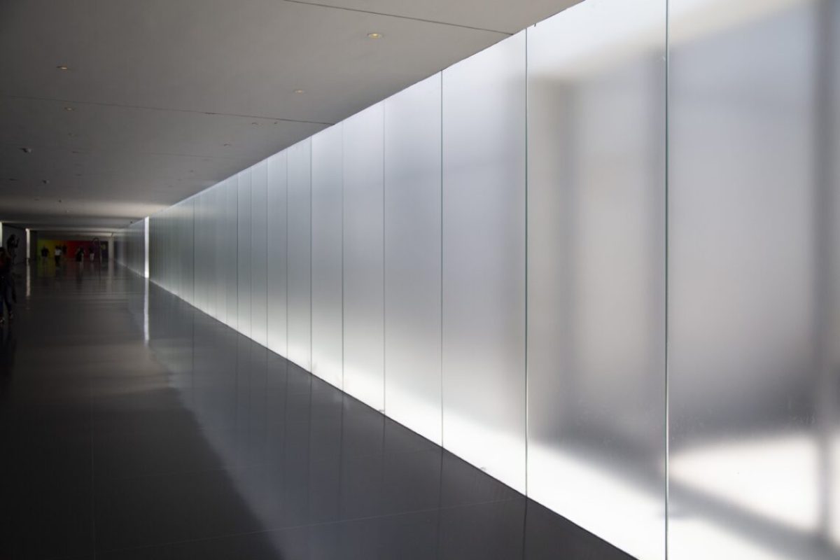 An underground pathway with people walking