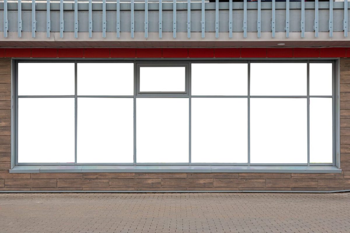 White empty sticker advertisements on windows of store